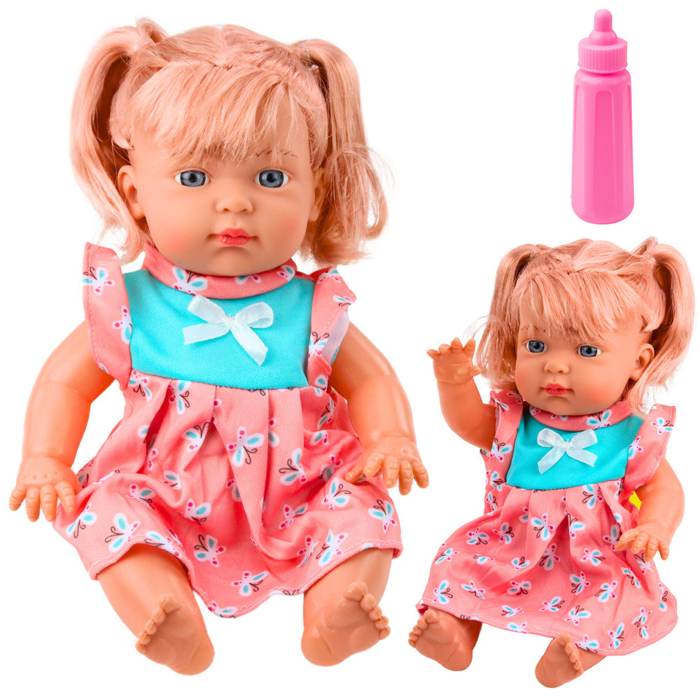 Hangot adó bébibaba színes ruhában, cumisüveggel, 30 cm